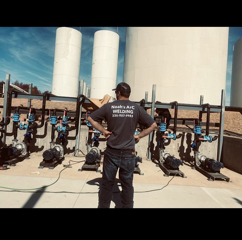 Noah's Arc Welding crew installing pipe and valve manifold at a commercial industrial site